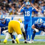 Detroit Lions quarterback Jared Goff (16) talks to teammates before a snap against Green Bay Packers during the first half at Ford Field in Detroit on Thursday, Dec. 5, 2024.