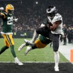 Sep 6, 2024; Sao Paulo, BRA; Philadelphia Eagles running back Saquon Barkley (26) catches a touchdown against Green Bay Packers linebacker Isaiah McDuffie (58) and safety Xavier McKinney (29) during the second quarter at Neo Quimica Arena.
