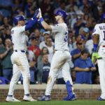 Sep 5, 2025; Chicago, Illinois, USA; Chicago Cubs right fielder Kyle Tucker (30) celebrates with second baseman Nico Hoerner (2) after hitting a three-run home run against the Atlanta Braves during the third inning at Wrigley Field.