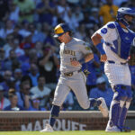 Aug 21, 2025; Chicago, Illinois, USA; Milwaukee Brewers right fielder Sal Frelick (10) scores against the Chicago Cubs during the eight inning at Wrigley Field. Mandatory Credit: Kamil Krzaczynski-Imagn Images