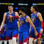 Mar 3, 2023; Denver, Colorado, USA; Denver Nuggets center Nikola Jokic (15) and guard Jamal Murray (27) and forward Aaron Gordon (50) celebrate after defeating the Memphis Grizzlies at Ball Arena.