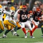 Cincinnati Bengals wide receiver Charlie Jones (15), second from right, finds a seam on a catch and run as Cincinnati Bengals guard Nate Gilliam (66) blocks during a Week 1 NFL preseason game between the Green Bay Packers and the Cincinnati Bengals,Friday, Aug. 11, 2023, at Paycor Stadium in Cincinnati.