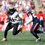 Patriots Saints Oct 8, 2023; Foxborough, Massachusetts, USA; New Orleans Saints running back Alvin Kamara (41) runs with the ball against New England Patriots J.C. Jackson (29) during the first half at Gillette Stadium. Mandatory Credit: Brian Fluharty-USA TODAY Sports