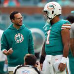 Dec 24, 2023; Miami Gardens, Florida, USA; Miami Dolphins head coach Mike McDaniel talks with quarterback Tua Tagovailoa (1) prior to the game against the Dallas Cowboys at Hard Rock Stadium.