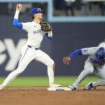 Onde assistir Apr 27, 2024; Toronto, Ontario, CAN; Toronto Blue Jays second baseman Cavan Biggio (8) throws to first base after getting the force out against Los Angeles Dodgers right fielder Teoscar Hernandez (37) during the third inning at Rogers Centre. Mandatory Credit: John E. Sokolowski-USA TODAY Sports