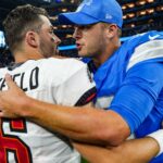 Tampa Bay Buccaneers quarterback Baker Mayfield (6) hugs Detroit Lions quarterback Jared Goff (16) at the end of the Detroit Lions game against the Tampa Bay Buccaneers at Ford Field in Detroit on Sunday, Sept. 15, 2024. Buccaneers won 20-16.