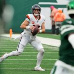 Sep 29, 2024; East Rutherford, New Jersey, USA; Denver Broncos quarterback Bo Nix (10) looks for a receiver against the New York Jets during the second half at MetLife Stadium.