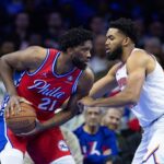 Nov 12, 2024; Philadelphia, Pennsylvania, USA; Philadelphia 76ers center Joel Embiid (21) controls the ball against New York Knicks center Karl-Anthony Towns (32) during the first quarter at Wells Fargo Center.