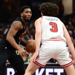 Nov 15, 2024; Cleveland, Ohio, USA; NBA; Chicago Bulls guard Josh Giddey (3) defends Cleveland Cavaliers guard Donovan Mitchell (45) during the first half at Rocket Mortgage FieldHouse.