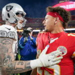 Nov 29, 2024; Kansas City, Missouri, USA; Kansas City Chiefs quarterback Patrick Mahomes (15) greets Las Vegas Raiders defensive end Maxx Crosby (98) after the game at GEHA Field at Arrowhead Stadium.