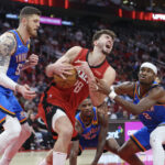 Dec 1, 2024; Houston, Texas, USA; NBA; Houston Rockets center Alperen Sengun (28) attempts to secure the ball away from Oklahoma City Thunder center Isaiah Hartenstein (55) and guard Shai Gilgeous-Alexander (2) during the fourth quarter at Toyota Center.