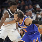 Dec 19, 2024; Minneapolis, Minnesota, USA; New York Knicks guard Jalen Brunson (11) works around Minnesota Timberwolves guard Anthony Edwards (5) in the third quarter at Target Center.