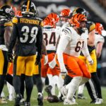 NFL; Cincinnati Bengals guard Cody Ford (61) stumbles to his feet after a pile player fall on his lower leg in the first quarter of the NFL Week 18 game between the Pittsburgh Steelers and the Cincinnati Bengals at Acrisure Stadium in Pittsburgh on Saturday, Jan. 4, 2025.