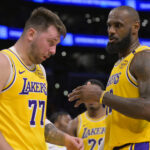 Lakers LeBron Luka Doncic Feb 10, 2025; Los Angeles, California, USA; Los Angeles Lakers forward LeBron James (23) checks on guard Luka Doncic (77) after he was hit in the face against the Utah Jazz at Crypto.com Arena.
