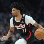 Mar 12, 2025; Portland, Oregon, USA; Portland Trail Blazers shooting guard Shaedon Sharpe (17) dribbles the ball against the New York Knicks during the first half at Moda Center.