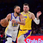 Luka Doncic Curry Warriors Lakers Apr 3, 2025; Los Angeles, California, USA; NBA; Golden State Warriors guard Stephen Curry (30) moves to the basket against Los Angeles Lakers guard Luka Doncic (77) during the second half at Crypto.com Arena.