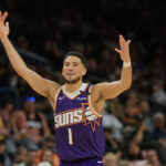 Apr 8, 2025; Phoenix, Arizona, USA; Phoenix Suns guard Devin Booker (1) reacts against the Golden State Warriors during the second half at Footprint Center. Mandatory Credit: Mark J. Rebilas-Imagn Images