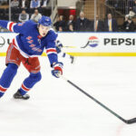 Apr 17, 2025; New York, New York, USA; New York Rangers center Matt Rempe (73) chases the puck in the first period against the Tampa Bay Lightning at Madison Square Garden. Mandatory Credit: Wendell Cruz-Imagn Images