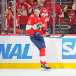 May 24, 2025; Sunrise, Florida, USA; Florida Panthers defenseman Niko Mikkola (77) celebrates after a goal during the third period against the Carolina Hurricanes in game three of the Eastern Conference Final of the 2025 Stanley Cup Playoffs at Amerant Bank Arena. Mandatory Credit: Sam Navarro-Imagn Images