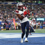Aug 21, 2025; East Rutherford, New Jersey, USA; New England Patriots safety Kyle Dugger (23) interception a pass in the end zone during the first half against the New York Giants at MetLife Stadium. Mandatory Credit: Vincent Carchietta-Imagn Images
