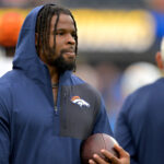 Sep 21, 2025; Inglewood, California, USA; Denver Broncos linebacker Dre Greenlaw (57) on the sidelines prior to the game against the Los Angeles Chargers at SoFi Stadium.