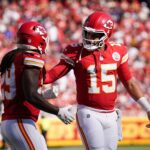 Sep 28, 2025; Kansas City, Missouri, USA; Kansas City Chiefs quarterback Patrick Mahomes (15) speaks with Kansas City Chiefs running back Kareem Hunt (29) during the second quarter against the Baltimore Ravens at GEHA Field at Arrowhead Stadium.