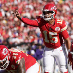 Sep 28, 2025; Kansas City, Missouri, USA; Kansas City Chiefs quarterback Patrick Mahomes (15) calls a play during the second quarter against the Baltimore Ravens at GEHA Field at Arrowhead Stadium.