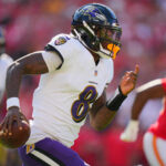 Sep 28, 2025; Kansas City, Missouri, USA; Baltimore Ravens quarterback Lamar Jackson (8) scrambles during the first half against the Kansas City Chiefs at GEHA Field at Arrowhead Stadium. Mandatory Credit: Jay Biggerstaff-Imagn Images