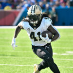 Sep 28, 2025; Orchard Park, New York, USA; New Orleans Saints running back Alvin Kamara (41) carries the ball against the Buffalo Bills in the third quarter at Highmark Stadium. Mandatory Credit: Mark Konezny-Imagn Images
