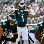 Oct 5, 2025; Philadelphia, Pennsylvania, USA; Philadelphia Eagles quarterback Jalen Hurts (1) calls a play against the Denver Broncos in the first quarter at Lincoln Financial Field. Mandatory Credit: Eric Hartline-Imagn Images