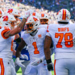 Oct 5, 2025; Seattle, Washington, USA; Tampa Bay Buccaneers running back Rachaad White (1) reacts with teammates after scoring a touchdown against the Seattle Seahawks during the first half at Lumen Field. Mandatory Credit: Steven Bisig-Imagn Images