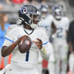 Oct 5, 2025; Glendale, Arizona, USA; Tennessee Titans quarterback Cam Ward (1) looks to throw against the Arizona Cardinals during the fourth quarter at State Farm Stadium. Mandatory Credit: Matt Kartozian-Imagn Images