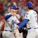 Oct 6, 2025; Philadelphia, Pennsylvania, USA; Los Angeles Dodgers first baseman Freddie Freeman (5) and designated hitter Shohei Ohtani (17) celebrate after defeating the Philadelphia Phillies in game two of the NLDS round for the 2025 MLB playoffs at Citizens Bank Park. Mandatory Credit: Bill Streicher-Imagn Images