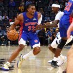 Oct 6, 2025; Memphis, Tennessee, USA; Detroit Pistons guard Jaden Ivey (23) dribbles the ball as Memphis Grizzlies forward Kentavious Caldwell-Pope (3) defends during the first quarter at FedExForum. Mandatory Credit: Petre Thomas-Imagn Images
