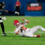 Kansas City Chiefs quarterback Patrick Mahomes (15) slids for a down against Jacksonville Jaguars linebacker Foye Oluokun (23) during the third quarter of an NFL football matchup at EverBank Stadium, Monday, Oct. 6, 2025, in Jacksonville, Fla. The Jacksonville Jaguars edged the Kansas City Chiefs 31-28. [Corey Perrine/Florida Times-Union]