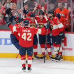 Oct 7, 2025; Sunrise, Florida, USA; Florida Panthers center Jesper Boqvist (70) celebrates with teammates after scoring against the Chicago Blackhawks during the third period at Amerant Bank Arena. Mandatory Credit: Sam Navarro-Imagn Images