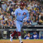 Oct 8, 2025; Los Angeles, California, USA; Philadelphia Phillies designated hitter Kyle Schwarber (12) celebrates after hitting a solo home run during the fourth inning against the Los Angeles Dodgers during game three of the NLDS round for the 2025 MLB playoffs at Dodger Stadium.