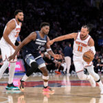 Oct 9, 2025; New York, New York, USA; New York Knicks guard Jalen Brunson (11) tries to drive past Minnesota Timberwolves guard Anthony Edwards (5) during the second half at Madison Square Garden. Mandatory Credit: John Jones-Imagn Images