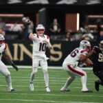 Oct 12, 2025; New Orleans, Louisiana, USA; New England Patriots quarterback Drake Maye (10) throws downfield during the second half against the New Orleans Saints at Caesars Superdome. Mandatory Credit: Matthew Hinton-Imagn Images