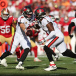 Oct 12, 2025; Tampa, Florida, USA; Tampa Bay Buccaneers quarterback Baker Mayfield (6) hands the ball off to running back Rachaad White (1) during the second quarter against the San Francisco 49ers at Raymond James Stadium.