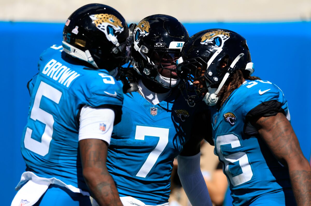 Jacksonville Jaguars wide receiver Brian Thomas Jr. (7) is congratulated by wide receiver Dyami Brown (5) and running back Lequint Allen Jr. (36) on a touchdown that was called back on a offensive penalty during the third quarter of an NFL football matchup, Sunday, Oct. 12, 2025, at EverBank Stadium in Jacksonville, Fla. The Seahawks defeated the Jaguars 20-12.