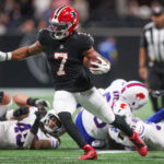 Oct 13, 2025; Atlanta, Georgia, USA; Atlanta Falcons running back Bijan Robinson (7) carries the ball against the Buffalo Bills during the first half of a game at Mercedes-Benz Stadium.