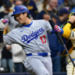 Oct 14, 2025; Milwaukee, Wisconsin, USA; Los Angeles Dodgers designated hitter Shohei Ohtani (17) gestures to fans prior to his at bat against the Milwaukee Brewers in the first inning during game two of the NLCS round for the 2025 MLB playoffs at American Family Field.