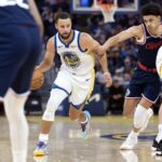 Oct 17, 2025; San Francisco, California, USA; Golden State Warriors guard Stephen Curry (30) drives past Los Angeles Clippers guard Kobe Sanders (4) during the first quarter at Chase Center.