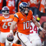 Oct 19, 2025; Denver, Colorado, USA; Denver Broncos quarterback Bo Nix (10) celebrates after play during the second half against the New York Giants at Empower Field at Mile High. Mandatory Credit: Ron Chenoy-Imagn Images