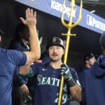 Oct 20, 2025; Toronto, Ontario, CAN; Seattle Mariners catcher Cal Raleigh (29) celebrates in the dugout after scoring against the Toronto Blue Jays in the fifth inning during game seven of the ALCS round for the 2025 MLB playoffs at Rogers Centre. Mandatory Credit: John E. Sokolowski-Imagn Images