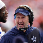 Oct 26, 2025; Denver, Colorado, USA; Dallas Cowboys head coach Brian Schottenheimer reacts in the first half against the Denver Broncos at Empower Field at Mile High. Mandatory Credit: Ron Chenoy-Imagn Images