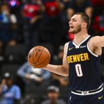 Oct 12, 2025; Inglewood, California, USA; Denver Nuggets forward Christian Braun (0) looks to pass the ball against the Los Angeles Clippers during the third quarter at Intuit Dome.