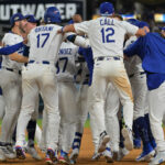 Oct 9, 2025; Los Angeles, California, USA; Los Angeles Dodgers designated hitter Shohei Ohtani (17) joins in on the celebration after defeating the Philadelphia Phillies in game four of the NLDS round for the 2025 MLB playoffs at Dodger Stadium.