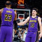 Mar 29, 2025; Memphis, Tennessee, USA; Los Angeles Lakers guard Austin Reaves (15) reacts with forward LeBron James (23) during the second quarter against the Memphis Grizzlies at FedExForum.
